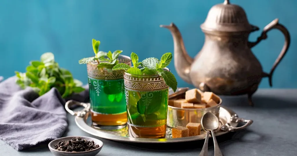 Gunpowder green tea, fresh spearmint, sugar cones and Moroccan teapot ingredients for Atay