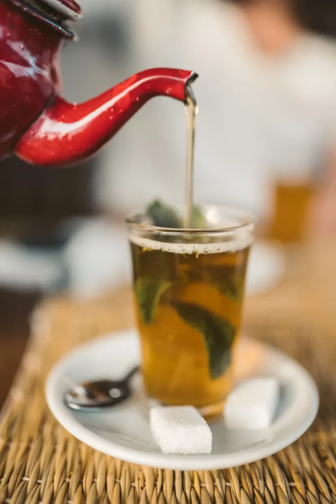 Moroccan tea ceremony showing mint tea poured from a height