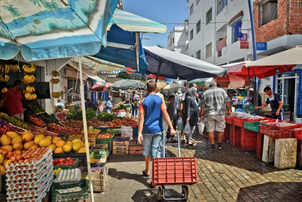 Cost of living in Morocco vs USA/Europe โ traditional souk market with spices and goods