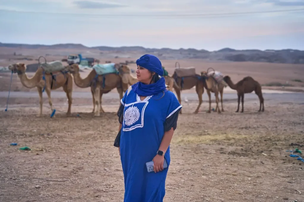 Traveler wearing layered clothing for cold desert nights in Morocco