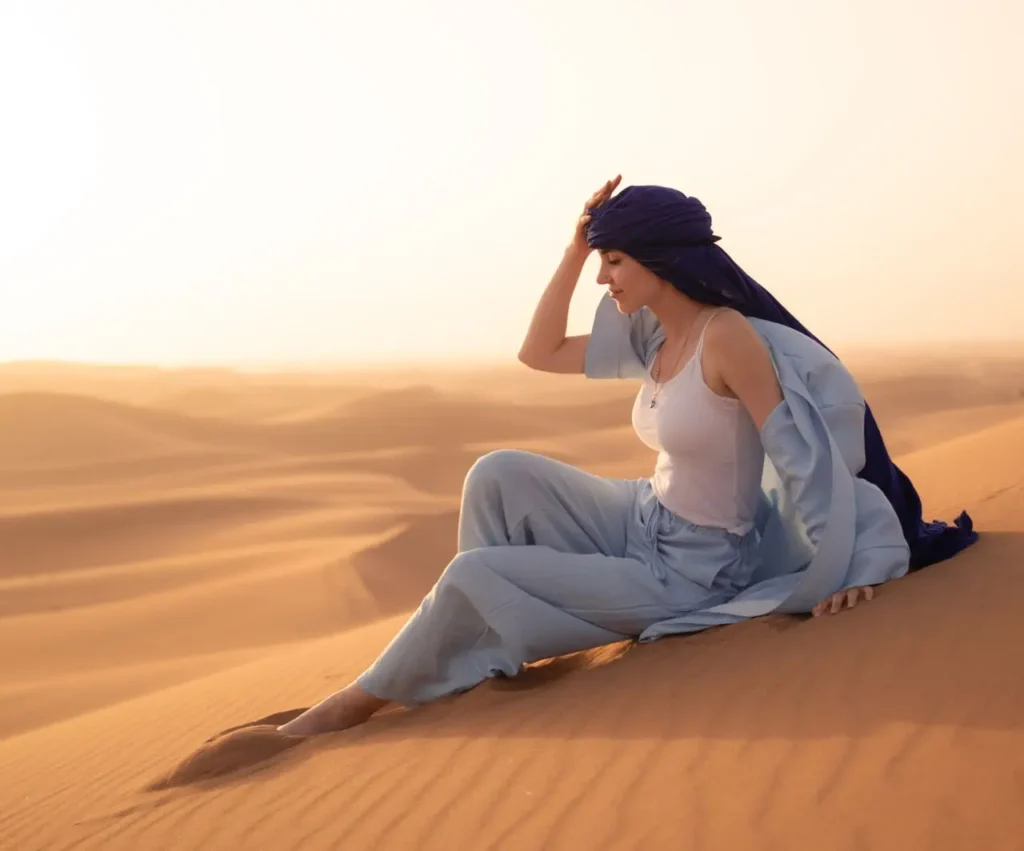 Woman wearing modest linen clothing and pashmina in Morocco