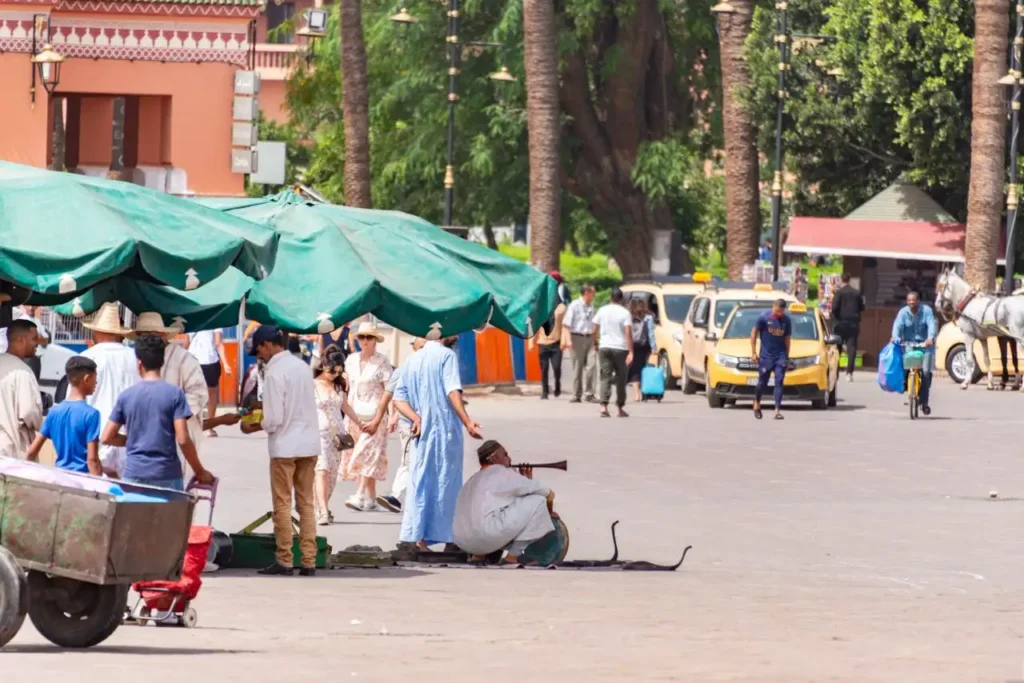 Petit taxi driving through narrow Marrakech Medina street